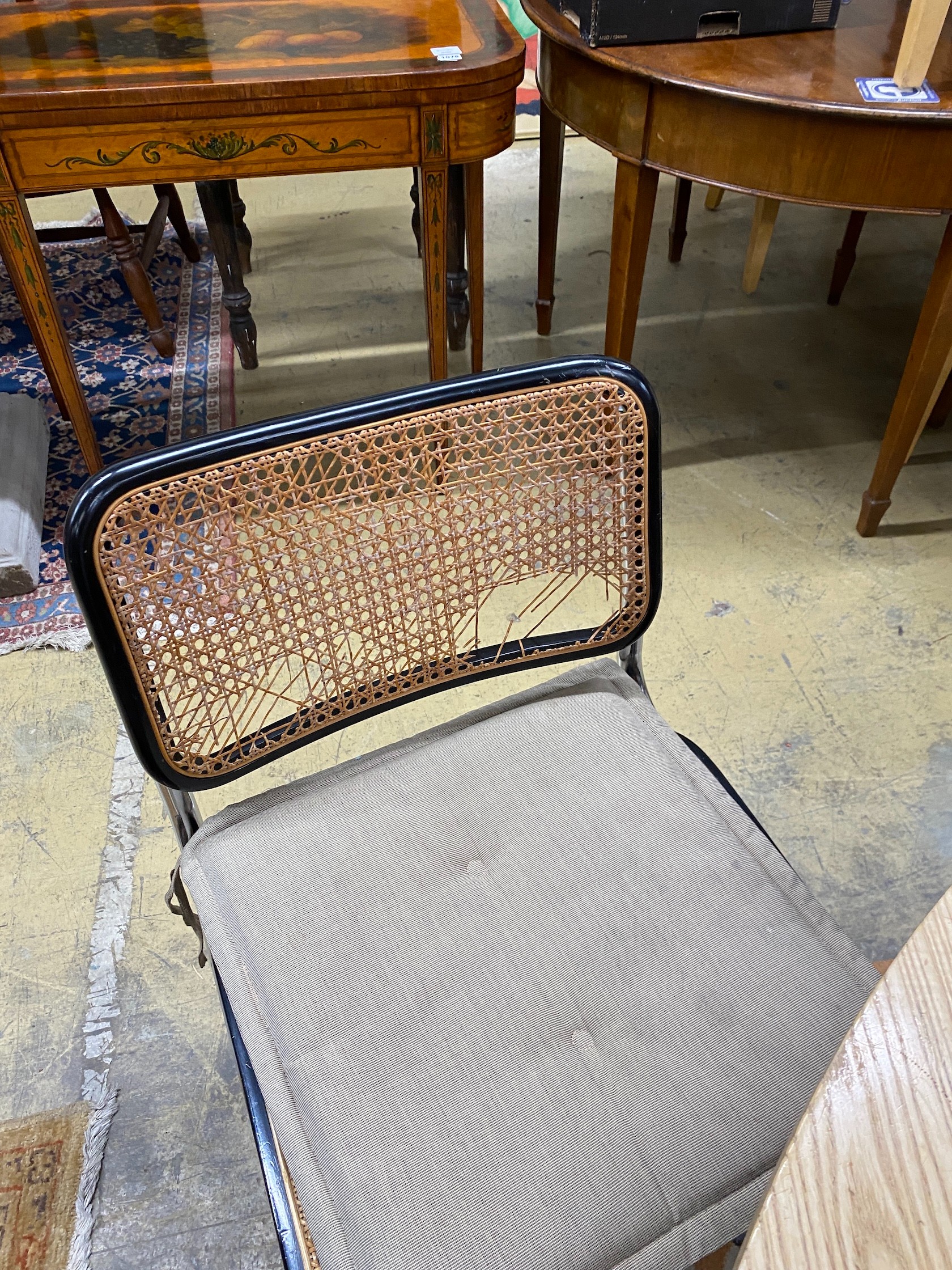 Six caned ebonized cantilever dining chairs in the style of Knoll Cesca by Marcel Breuer
